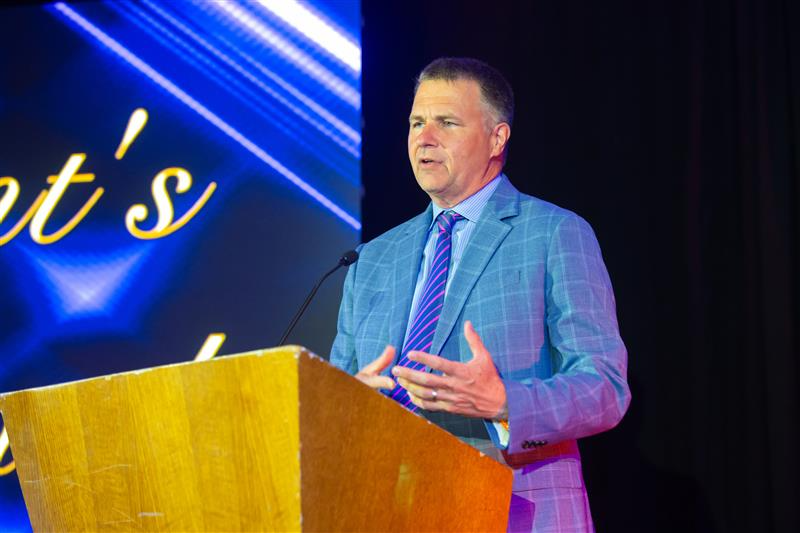 MedMutual Protect president, Charles Steele giving a speech at a podium.