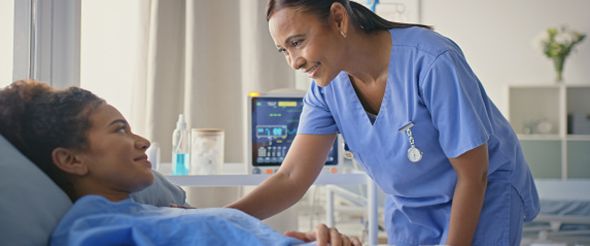 Woman being treated in a hospital bed.