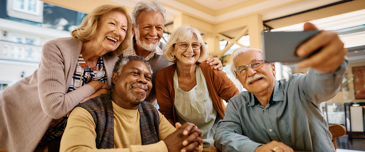 Group of people taking a selfie.