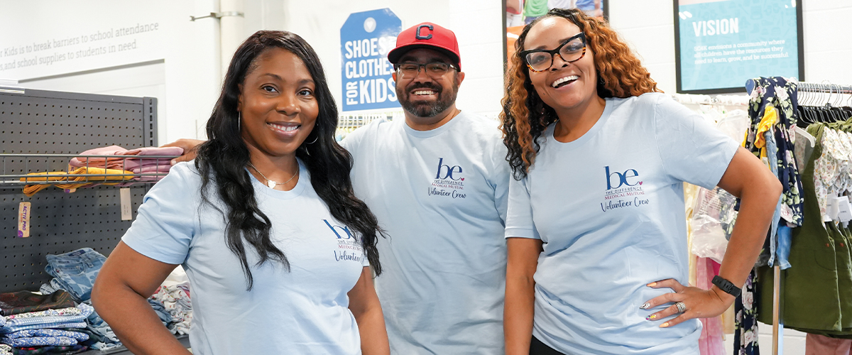 Three Medical Mutual employees out volunteering in the community.